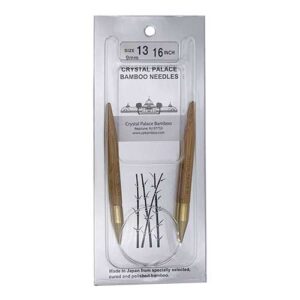 A size 13, 16 inch bamboo circular needle in its silver packaging